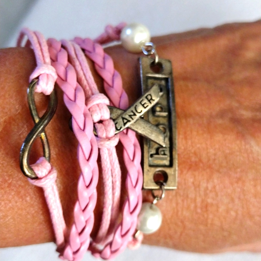 Beautiful braided leather and twine cure for cancer bracelet.